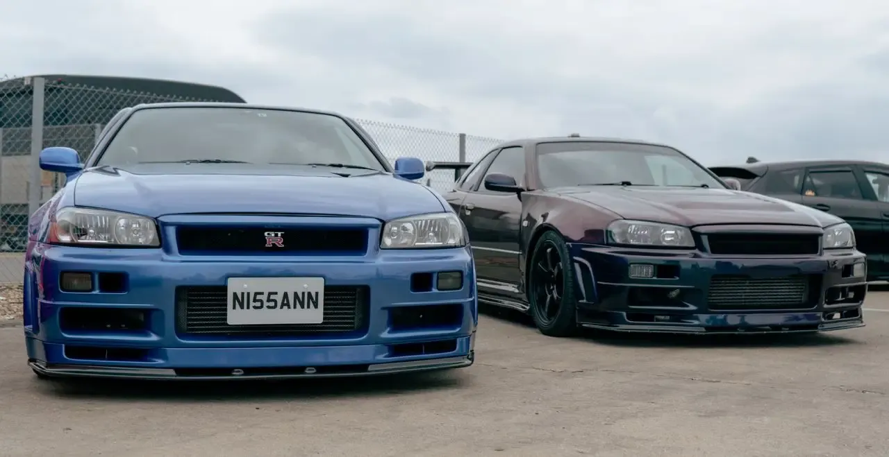 A Nissan Skyline R33 GT-R alongside an R34